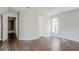 Bedroom with wood floors, neutral walls, ceiling light and windows at 3604 Cameron Hills Pl, Ellenwood, GA 30294