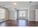 Bright bedroom with wood floors, a ceiling light, neutral walls and two windows for natural light at 3604 Cameron Hills Pl, Ellenwood, GA 30294