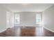 Spacious bedroom features wood floors, neutral walls, ceiling light and windows for natural light at 3604 Cameron Hills Pl, Ellenwood, GA 30294
