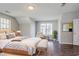 Bright bedroom with hardwood floors, comfortable seating, and lots of natural light at 3604 Cameron Hills Pl, Ellenwood, GA 30294
