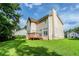 Two story home with a deck and green lawn at 3604 Cameron Hills Pl, Ellenwood, GA 30294