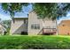 Two story home with a deck and well maintained lawn at 3604 Cameron Hills Pl, Ellenwood, GA 30294