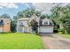 Inviting two-story home with a well-manicured lawn and attached two car garage at 3604 Cameron Hills Pl, Ellenwood, GA 30294