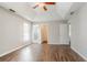 Bright main bedroom with tray ceiling, ceiling fan, and luxury vinyl plank flooring at 3604 Cameron Hills Pl, Ellenwood, GA 30294