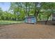 View of backyard with storage shed and mature trees providing shade at 531 Atlanta Se Ave, Atlanta, GA 30315
