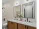 Bathroom featuring double sinks with wood cabinets and matching mirrors at 531 Atlanta Se Ave, Atlanta, GA 30315