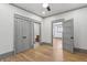 Bedroom featuring gray trim, hardwood flooring, and a hallway entrance at 531 Atlanta Se Ave, Atlanta, GA 30315