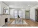 Bright dining area featuring wood floors, brick fireplace, and seating for four at 531 Atlanta Se Ave, Atlanta, GA 30315