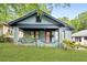 Charming home featuring a covered porch, brick facade, and well-maintained front yard at 531 Atlanta Se Ave, Atlanta, GA 30315
