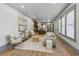 Open-concept living room that flows into the kitchen with natural light and seating at 531 Atlanta Se Ave, Atlanta, GA 30315