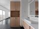 Bathroom showcasing vanity with sink and open storage; dark flooring and balcony access at 199 14Th Ne St # 3003, Atlanta, GA 30309