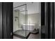 Sleek bathroom featuring a glass-enclosed shower and a modern soaking tub, offering a spa-like experience at 199 14Th Ne St # 3003, Atlanta, GA 30309