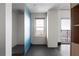 Bright bathroom featuring a modern shower with gray tile flooring and an exterior window with a scenic view at 199 14Th Ne St # 3003, Atlanta, GA 30309