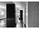 Modern home hallway with a wine rack and hardwood floors leads to a window with beautiful views at 199 14Th Ne St # 3003, Atlanta, GA 30309