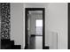 Hallway showcasing dark hardwood floors leading to a balcony with scenic views at 199 14Th Ne St # 3003, Atlanta, GA 30309