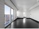 Elegant living room boasts dark floors, neutral walls, and a balcony with views at 199 14Th Ne St # 3003, Atlanta, GA 30309