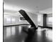 Spacious open-concept living area with dark floors, and unique staircase and natural light at 199 14Th Ne St # 3003, Atlanta, GA 30309
