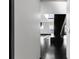 Modern living area with dark floors, a unique staircase, and minimalist design at 199 14Th Ne St # 3003, Atlanta, GA 30309