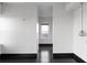 Bright living room with dark wood floors, white walls, and a window with city views in the distance at 199 14Th Ne St # 3003, Atlanta, GA 30309