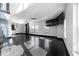 Stylish living area with dark floors, modern staircase, TV, and city views at 199 14Th Ne St # 3003, Atlanta, GA 30309
