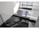 Modern staircase featuring sleek design and abundant natural light from large windows at 199 14Th Ne St # 3003, Atlanta, GA 30309