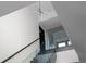 Modern staircase with glass railing and unique chandelier under a high ceiling at 199 14Th Ne St # 3003, Atlanta, GA 30309
