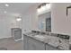 Bathroom features a vanity with granite countertop and a shower at 250 Stonecreek Pkwy, Covington, GA 30016