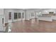 Spacious living room featuring hardwood floors, fireplace, and sliding glass doors to the backyard at 250 Stonecreek Pkwy, Covington, GA 30016