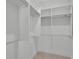 Spacious walk-in closet with ample shelving and hanging space, ready for organization at 345 Sugarview Rd, Sugar Hill, GA 30518