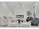 Cozy living room with a fireplace, modern lighting and stylish furnishings at 345 Sugarview Rd, Sugar Hill, GA 30518