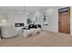 Inviting living room features a fireplace, modern furnishings, and large windows at 345 Sugarview Rd, Sugar Hill, GA 30518