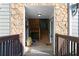 Entrance featuring stone walls, wooden stairs and neutral paint at 1102 Madison Se Ln # 1102, Smyrna, GA 30080