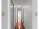 Hallway view with hardwood floors and white walls at 1102 Madison Se Ln # 1102, Smyrna, GA 30080
