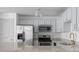 Updated kitchen includes stainless appliances, granite counters, and modern fixtures at 1102 Madison Se Ln # 1102, Smyrna, GA 30080