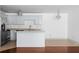 Modern kitchen with stainless steel appliances, granite countertops, and a breakfast bar at 1102 Madison Se Ln # 1102, Smyrna, GA 30080