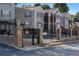 Community pool featuring black iron fence and stone columns at 1102 Madison Se Ln # 1102, Smyrna, GA 30080
