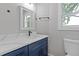 A contemporary bathroom showcasing a modern vanity, sink, mirror and lighting at 1164 Red Oak Cv, Tucker, GA 30084