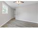 This bedroom features hardwood floors, natural lighting and is freshly painted at 1164 Red Oak Cv, Tucker, GA 30084