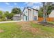 Exterior view of a white two story home with a bright blue front door and green grass at 1164 Red Oak Cv, Tucker, GA 30084