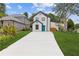 Charming two-story home featuring a bright blue front door and a long driveway at 1164 Red Oak Cv, Tucker, GA 30084