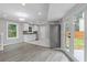 Modern kitchen with white cabinets, stainless steel appliances, and ample counter space at 1164 Red Oak Cv, Tucker, GA 30084