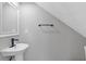 A stylish powder room featuring modern fixtures, sink and a sleek design at 1164 Red Oak Cv, Tucker, GA 30084