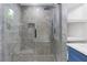 The modern shower features sleek tile work, glass enclosure, and a rainfall showerhead at 1164 Red Oak Cv, Tucker, GA 30084