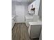 Beautiful kitchen with white cabinetry, stainless steel sink, and hardwood floors at 3201 Fairington Dr, Lithonia, GA 30038