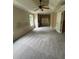 Bedroom with neutral carpet, ceiling fan, and natural light streaming through windows at 3324 Whitmore Ct, Acworth, GA 30101