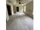 Bright bedroom featuring a ceiling fan, tray ceilings, neutral walls, carpet and natural light from multiple windows at 3324 Whitmore Ct, Acworth, GA 30101