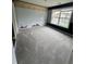 Spacious bedroom with neutral carpet, and large window providing plenty of natural light at 3324 Whitmore Ct, Acworth, GA 30101