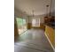 Cozy breakfast nook featuring wood-look floors, a sliding door to a deck, and backyard view at 3324 Whitmore Ct, Acworth, GA 30101