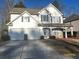 Charming two-story home features a two-car garage and a well-maintained front yard at 3324 Whitmore Ct, Acworth, GA 30101