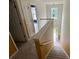 Carpeted staircase with white railings leading to the upper level of the home at 3324 Whitmore Ct, Acworth, GA 30101